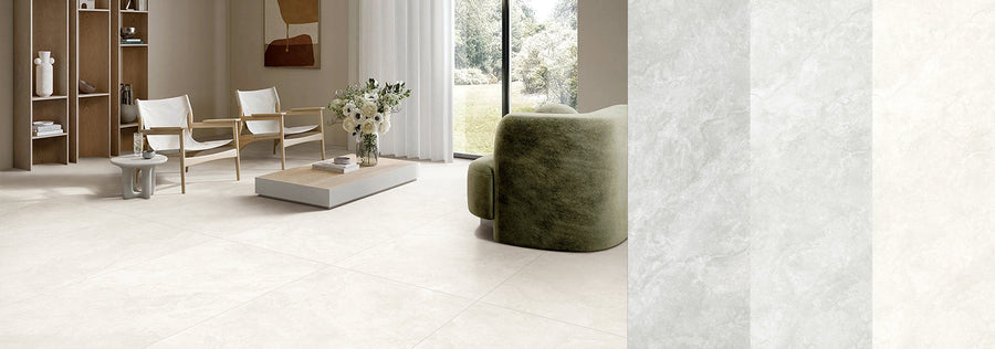 Pale stone look porcelain floor tiles in a living room that opens to a garden