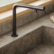 Gessi Su and Gi Retractable Spout Right Angle Mixer in a styled room