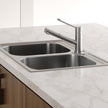 Essente Stainless Steel Care Handle For Swivel Mixer in a styled room