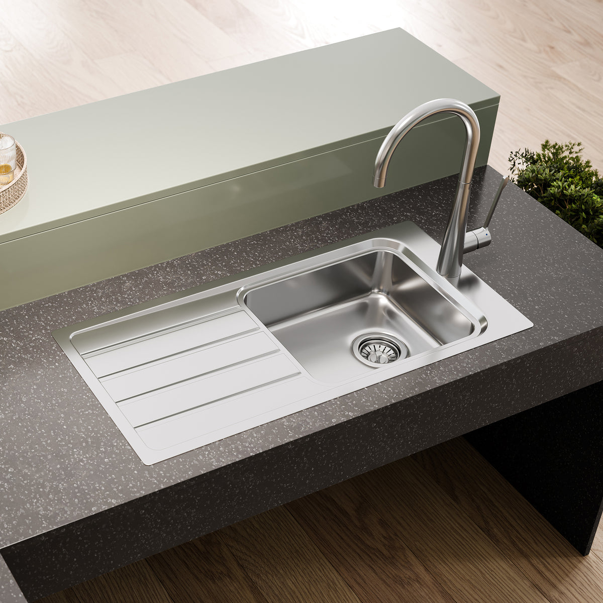 Puro Single Bowl Topmount Care Sink With Drainer in a styled room