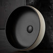 Terzofoco Light Earth and Matte Black Curved Counter Top Basin in a styled room