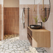 Venice Stainless Steel Heated Vertical Towel Rail in a styled room