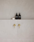 Bloom Wall Mixer styled in a bathroom