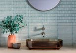 Auristella Verde Gloss Porcelain Subway Tiles in a room setting