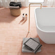 Coco Orchard Pink Matt Porcelain Subway Tiles in a room setting