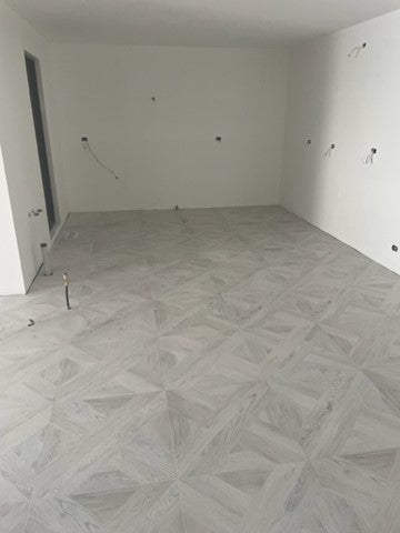 Intarsio Bianco Matt Timber Look Porcelain Tiles in a room setting