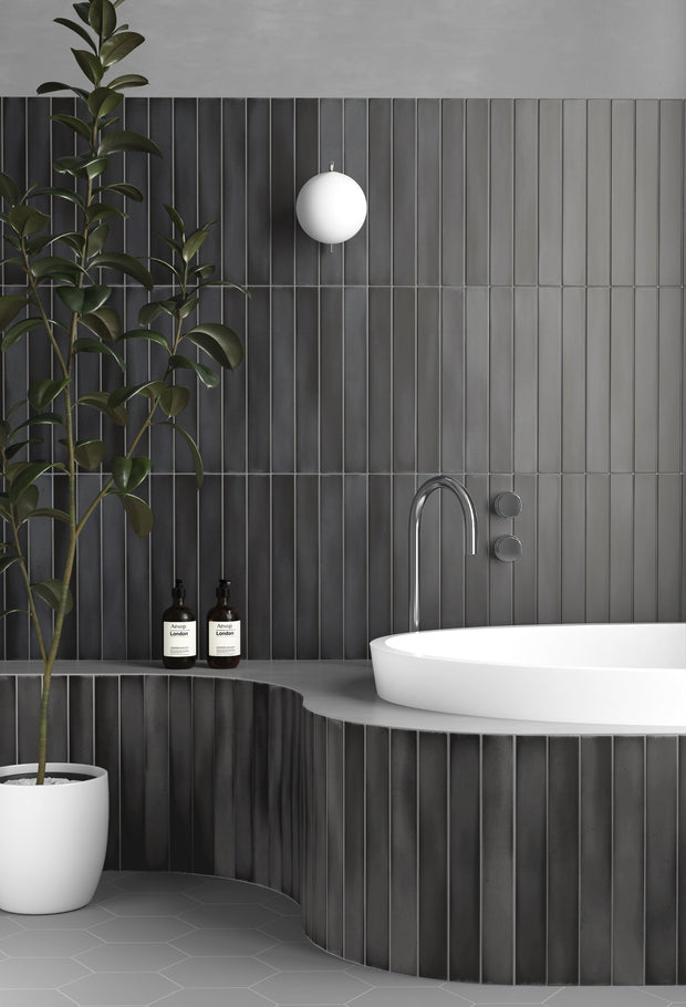 Massimo Dark Black Satin Ceramic Subway Tiles in a room setting