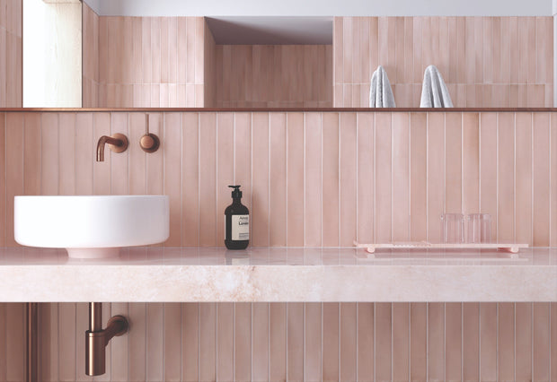 Massimo Pink Sand Satin Ceramic Subway Tiles in a room setting