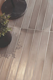 Massimo Siena Earth Satin Ceramic Subway Tiles in a room setting