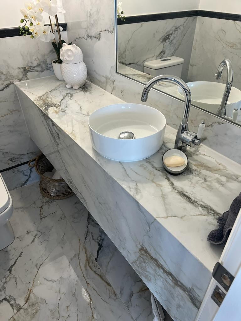 Pisa Gold Polished Marble Look Porcelain Tiles in a room setting