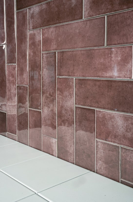 Shallow Aubergine Gloss Porcelain Subway Tiles in a room setting
