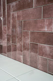 Shallow Aubergine Gloss Porcelain Subway Tiles in a room setting