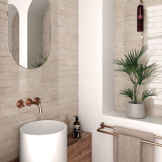 Tribeca Oatmeal Gloss Porcelain Subway Tiles in a room setting