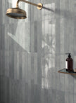 Verticale Moody Blue Gloss Porcelain Subway Tiles 50x400mm in a room setting
